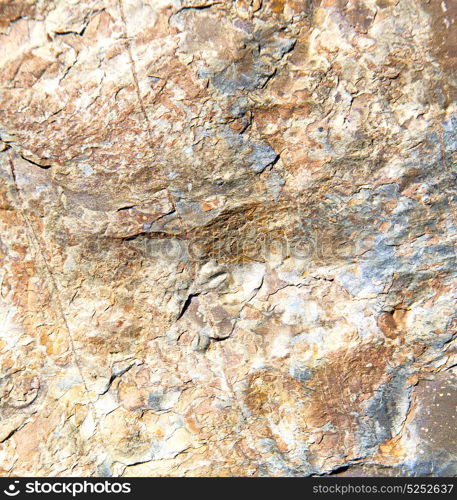 rocks stone and red orange gneiss in the wall of morocco