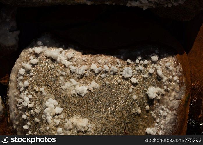 rocks with salt near sea hot spring volcano sourge. Salt on rocks