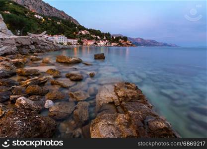 Rocky Beach and Small Village near Omis in the Evening, Dalmatia, Croatia