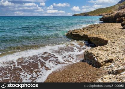 Rocky beach with turquoise waters in Kythera island at summer, Greece.. Rocky beach with turquoise waters in Kythera island at summer in Greece