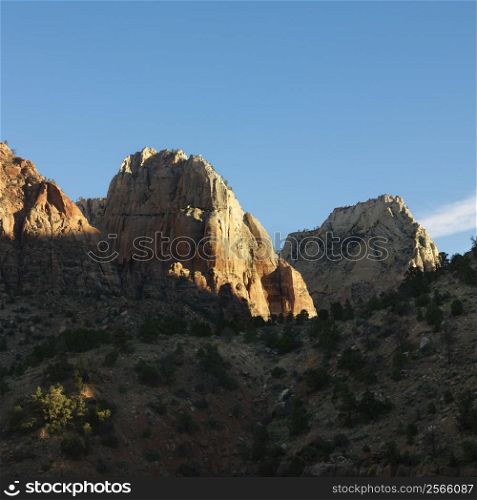 Rocky cliffs and rock formations in desert of Zion National Park, Utah.
