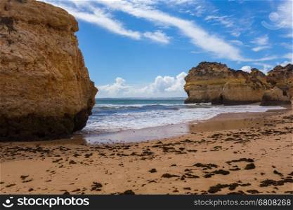 Rocky cliffs on the coast of the Atlantic ocean in Lagos, Algarve, Portugal