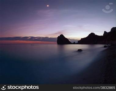 Rocky coastline after sunset. Crimea, Ukraine