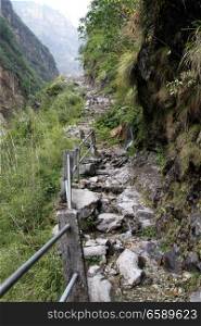 Rocky footpath near the rock on the Annapurna trail in Nepal