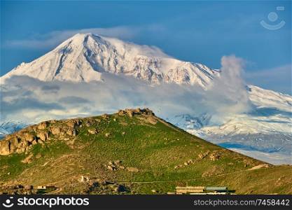 Rocky hill landscape at morning in Armenia with Ararat mountain at background