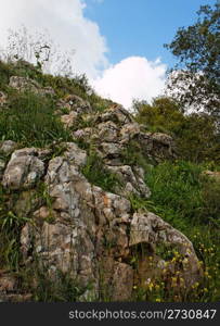 Rocky hill slope in a cloudy day