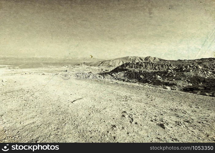 Rocky hills of the Negev Desert in Israel. Wind carved rock formations in the Southern Israel Desert. Vintage style toned picture