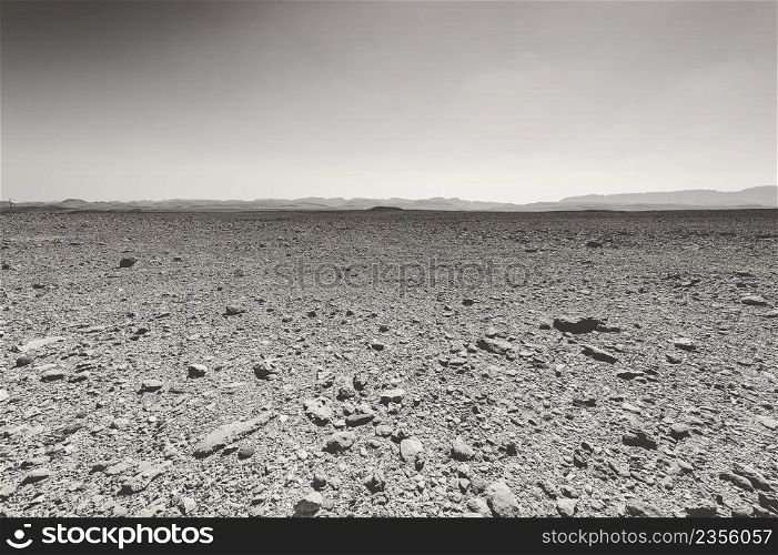 Rocky hills of the Negev Desert in Israel. Breathtaking landscape and nature of the Middle East. Black and white photo