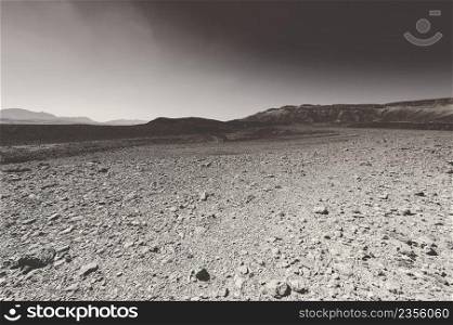 Rocky hills of the Negev Desert in Israel. Breathtaking landscape and nature of the Middle East. Black and white photo