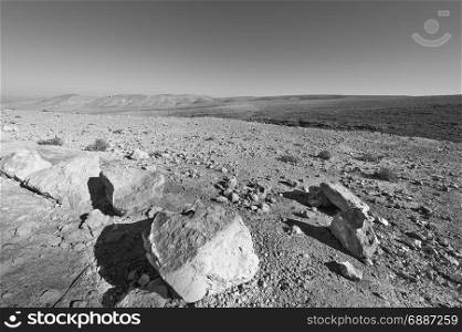 Rocky hills of the Negev Desert in Israel. Breathtaking landscape of the desert rock formations in the Southern Israel Desert. Black and white picture
