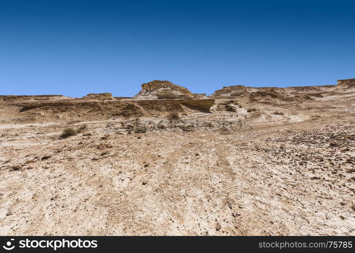 Rocky hills of the Negev Desert in Israel. Breathtaking landscape of the desert rock formations in the Southern Israel Desert.