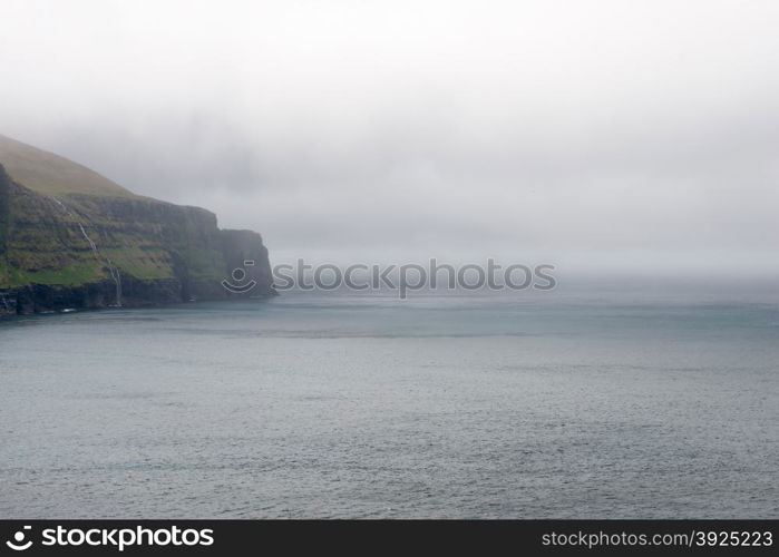 Rocky landscape on the Faroe Islands. Rocky landscape on the Faroe Islands with cliff and ocean