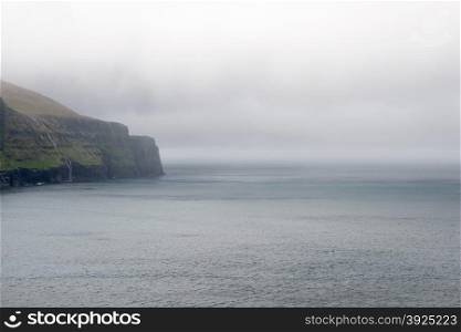 Rocky landscape on the Faroe Islands. Rocky landscape on the Faroe Islands with cliff and ocean