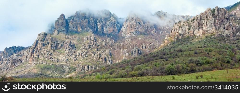 Rocky mountain misty panorama (Demerdzhi Mount, Crimea, Ukraine).Three shots stitch image.