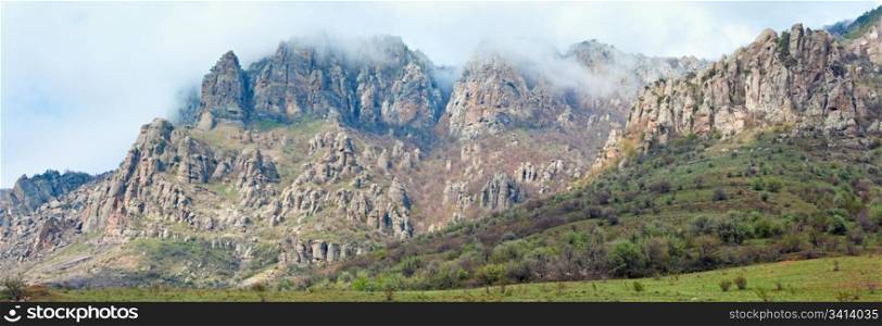 Rocky mountain misty panorama (Demerdzhi Mount, Crimea, Ukraine).Three shots stitch image.