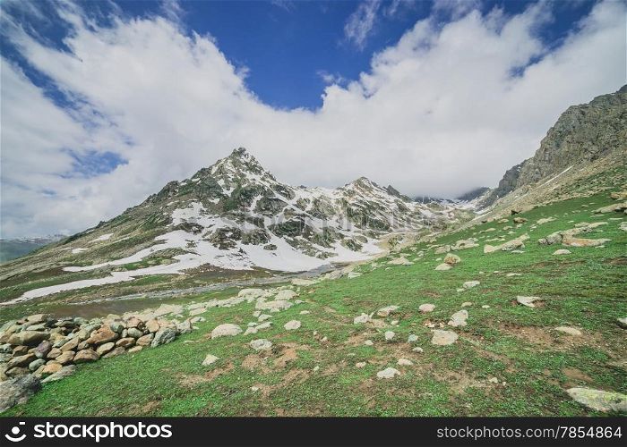 Rocky Mountains and green Field in Jammu and Kashmir