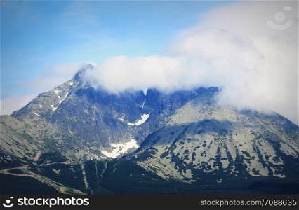 Rocky mountains covered with clouds in High Tatras, Slovakia .. Rocky mountains covered with clouds in High Tatras, Slovakia