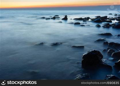 Rocky sea beach after sunset, Black Sea, Anapa, Russia