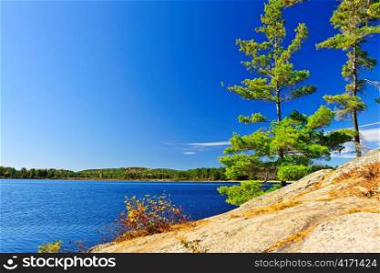 Rocky shore in wilderness of Lake of Two Rivers, Algonquin Park, Ontario, Canada