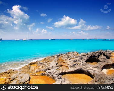 Rocky shore of formentera turquoise sea in Illetes
