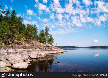 Rocky shore of the island on the lake . Ladoga Skerries, Karelia. Rocky shore of the island on the lake . Ladoga Skerries, Karelia.