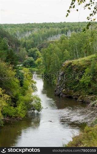 rocky shores of the river, covered with beautiful trees. landscape