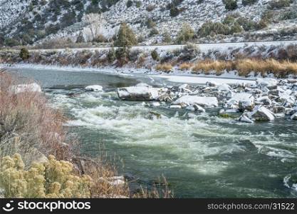 Rodeo Rapid on the upper Colorado River at Burns, Colorado, USA, looking upstream, winter scenery