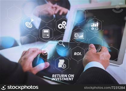 ROI Return on Investment indicator in virtual dashboard for improving business. Business team meeting present. Photo professional investor working with new startup project. Finance managers meeting.