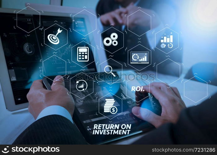 ROI Return on Investment indicator in virtual dashboard for improving business. Business team meeting present. Photo professional investor working with new startup project. Finance managers meeting.