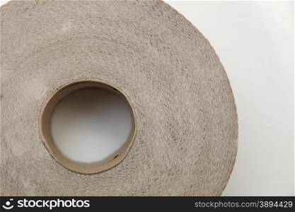 Roll of bathroom tissue. Close up of toilet paper from the recycling