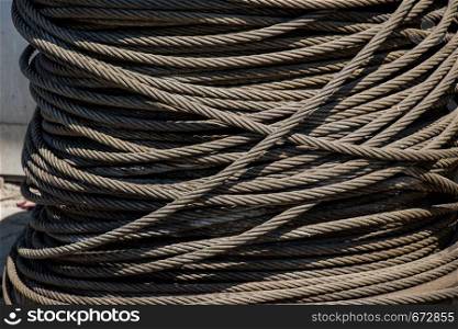 Roll of brown color linen string on grey background
