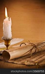 roll of old paper andle candle