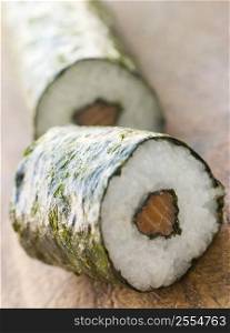Roll of Salmon Sushi on a Board