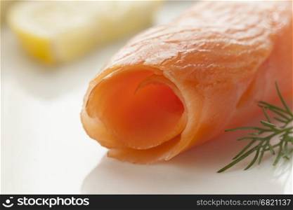 Roll of smoked salmon close up as a snack