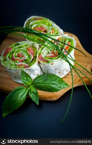 Roll pita with salad and salted salmon