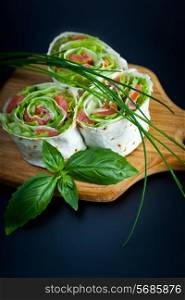 Roll pita with salad and salted salmon
