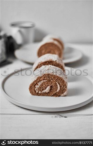 Roll small cake coffee with cream. . Roll small cake coffee.
