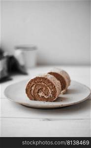 Roll small cake coffee with cream. . Roll small cake coffee.