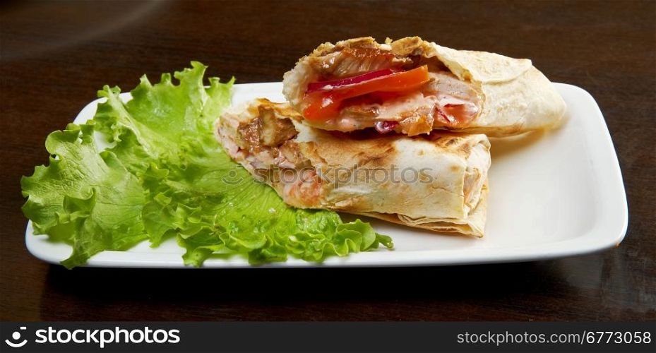 Roll, strudel from pancakes, crepes with porc, cheese, creamy tast