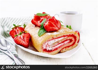 Roll with cream and strawberry jam, fresh strawberries and mint in a plate, napkin and spoons on wooden board background