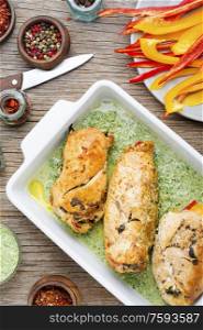 Rolled chicken breast stuffed with spinach and pepper. Baked chicken breast