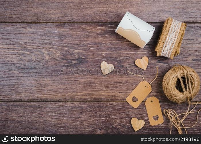 rolled up lace wooden heart shape tags jute spool wooden desk