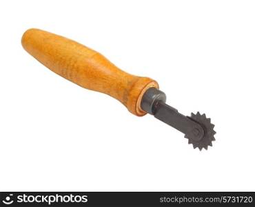 roller cutter for a tailor with a wooden handle on a white background