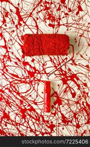 Roller paint brush with red paint
