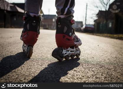 roller skating on the road, close up legs