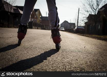 roller skating on the road, close up legs