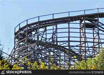 rollercoasters at an amusement park with blue sky
