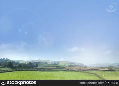 Rolling countryside background with blue sky.