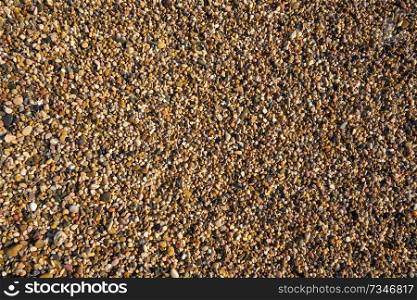 Rolling stones sand texture of Costa Dorada beach in Tarragona