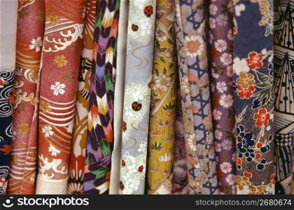 Rolls of different coloured fabrics